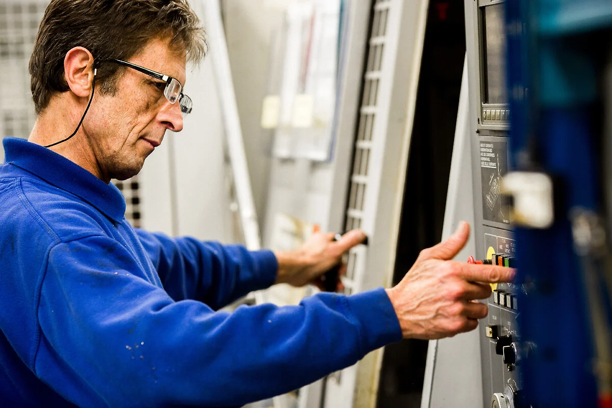 Technician repairing industrial machinery quickly